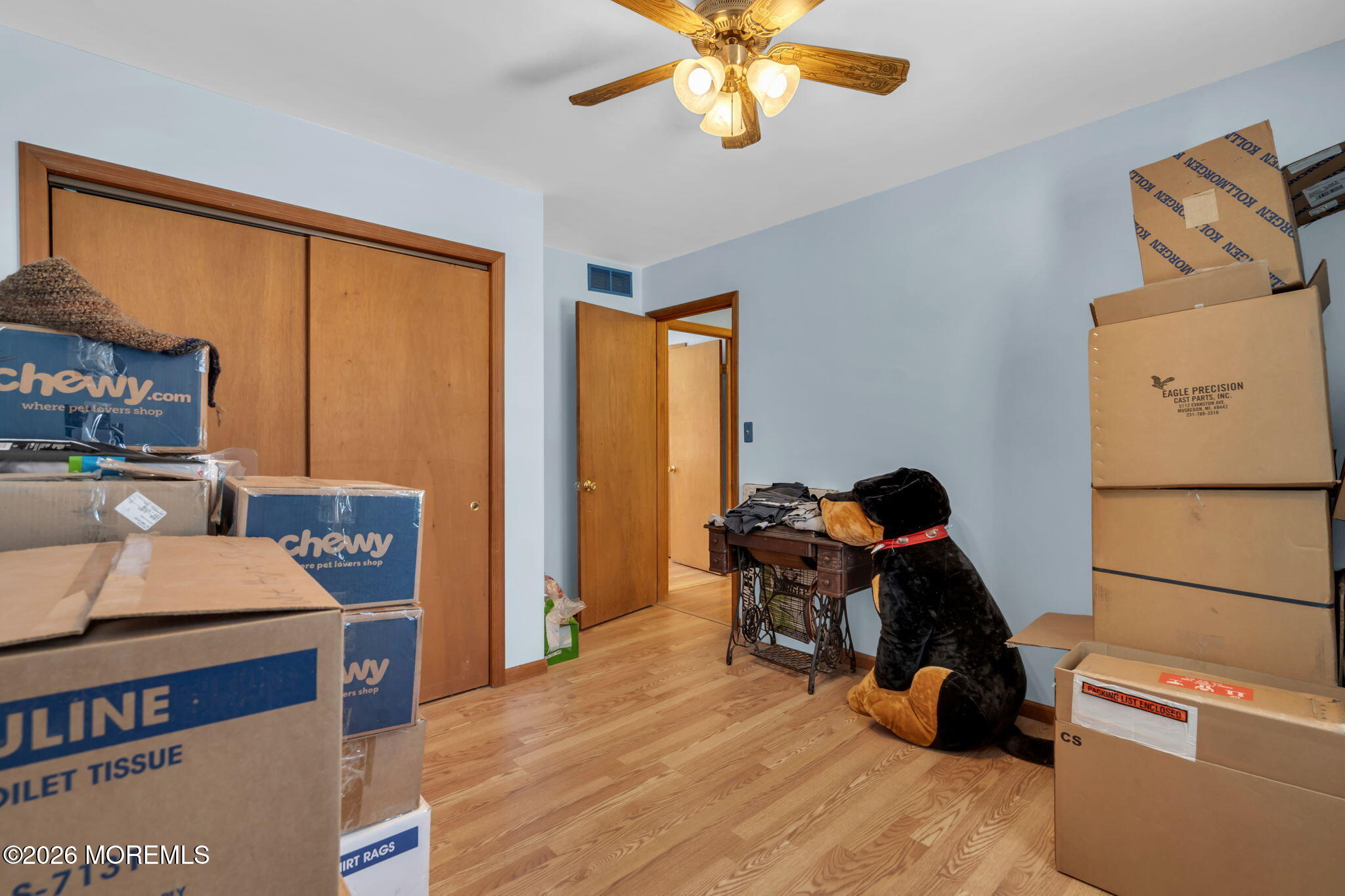177 Cedar Swamp Road Jackson, NJ 08527 - Photo 22 of 27 a bedroom with a bed and a chandelier