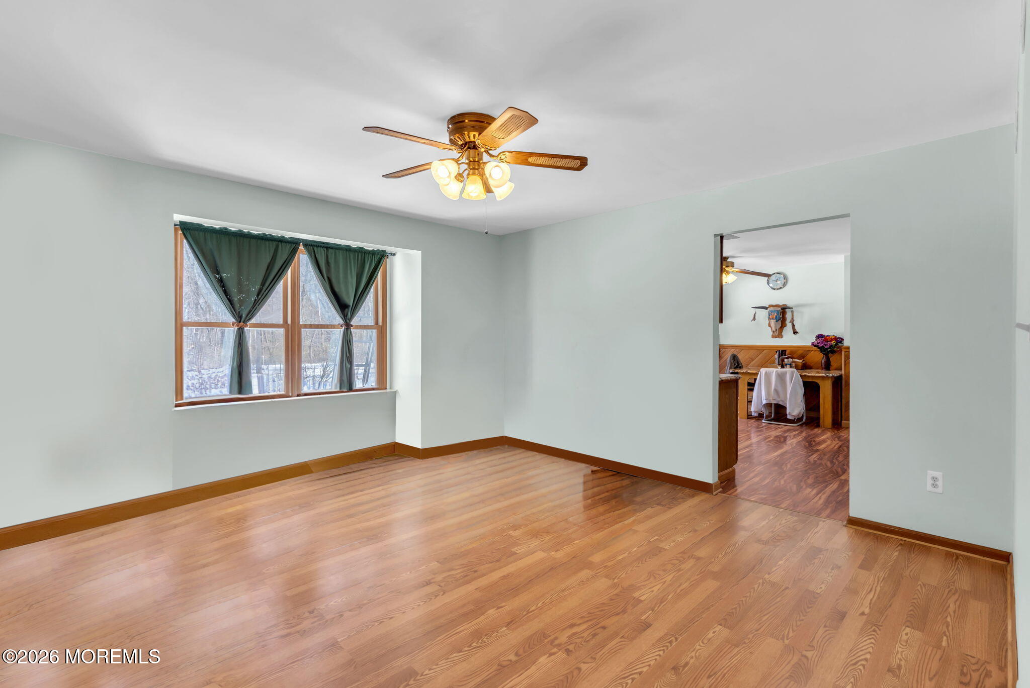 177 Cedar Swamp Road Jackson, NJ 08527 - Photo 7 of 27 wooden floor in an empty room with a window