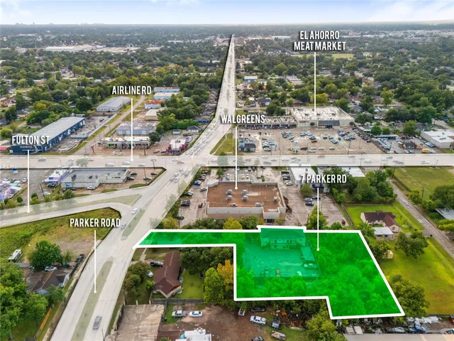 a view of a house with a patio and a yard