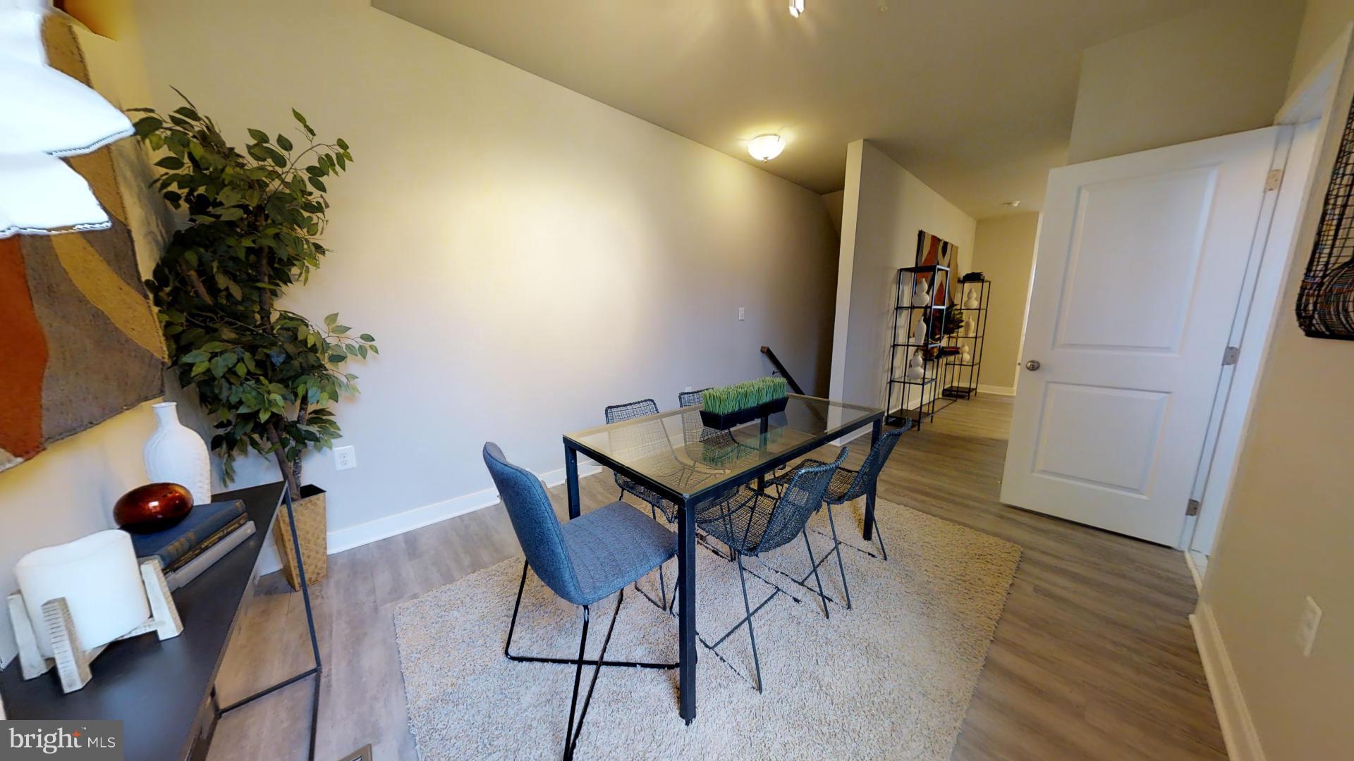 1262 Talbert Street Southeast, Unit B Washington, DC 20020 - Photo 11 of 18 a view of a room with furniture and potted plant