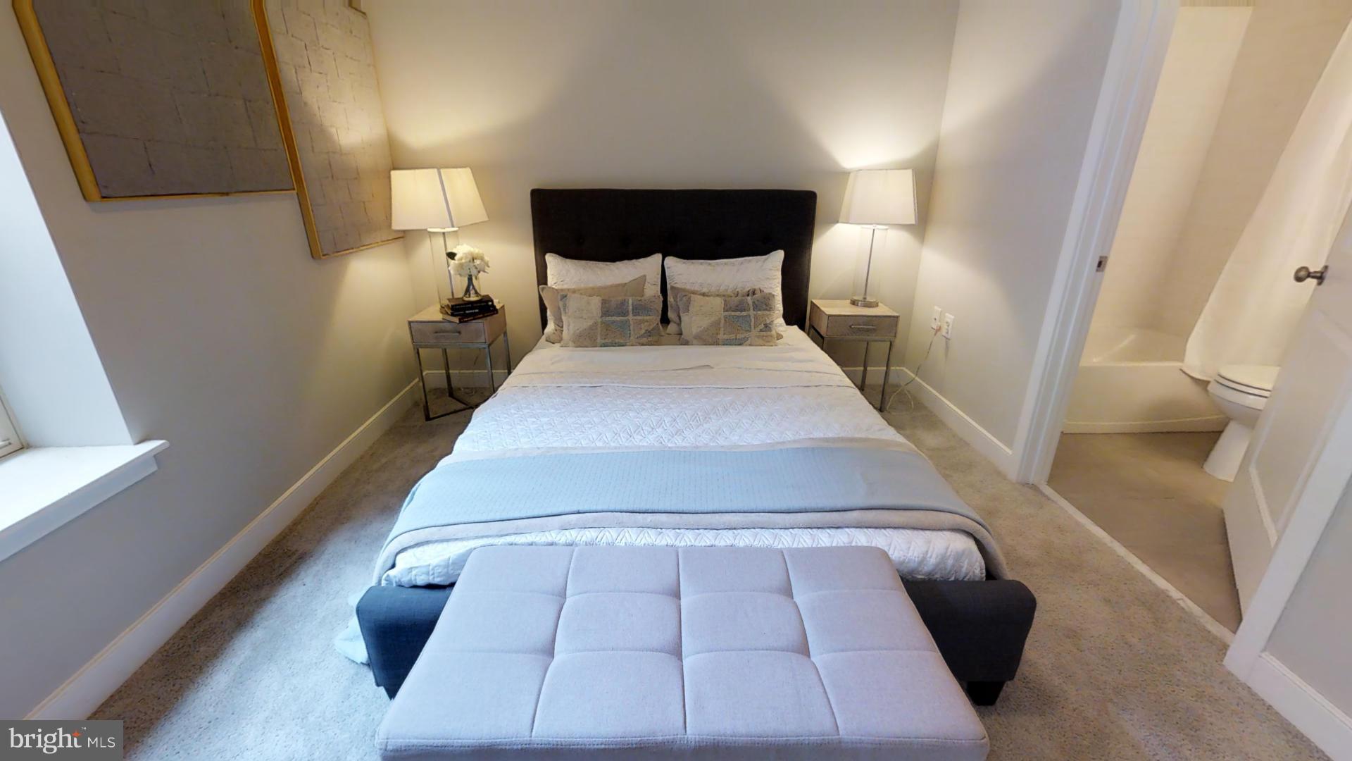 1262 Talbert Street Southeast, Unit B Washington, DC 20020 - Photo 13 of 18 a bed room with a bed and a large window