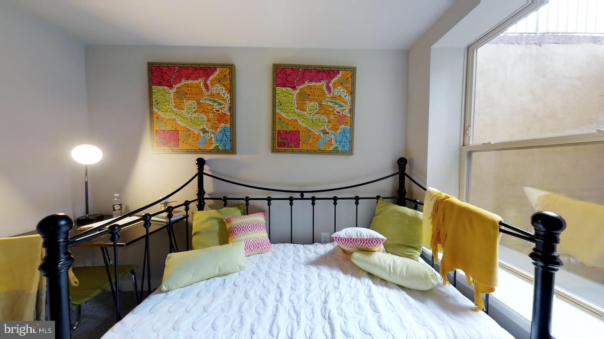 1262 Talbert Street Southeast, Unit B Washington, DC 20020 - Photo 16 of 18 a bedroom with bed and wooden floor