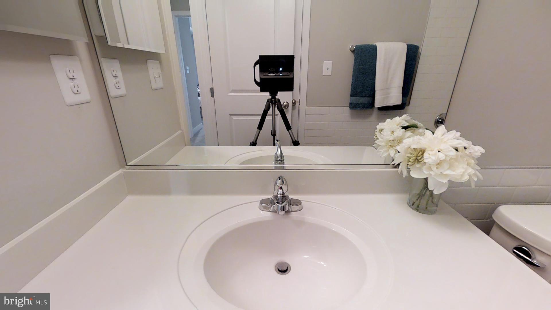 1262 Talbert Street Southeast, Unit B Washington, DC 20020 - Photo 17 of 18 a bathroom with a sink and mirror