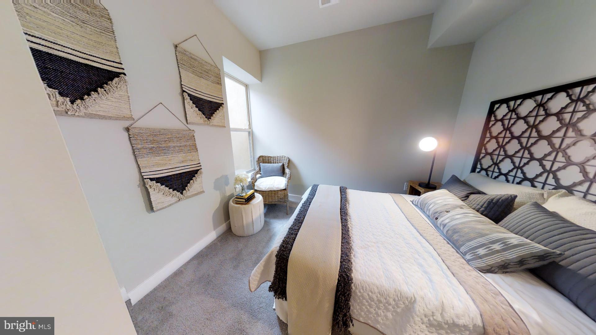 1262 Talbert Street Southeast, Unit B Washington, DC 20020 - Photo 18 of 18 a bedroom with a bed a couch and a window