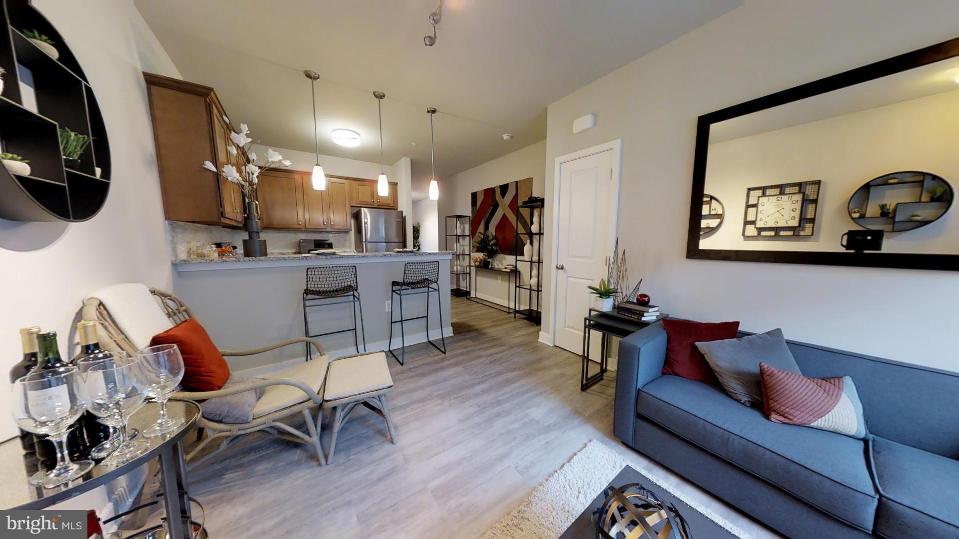 1262 Talbert Street Southeast, Unit B Washington, DC 20020 - Photo 2 of 18 a living room with furniture and a flat screen tv