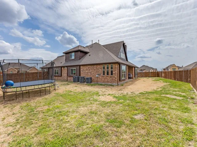 a front view of a house with swimming pool