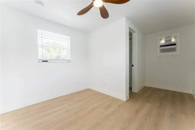 a view of an empty room with a window