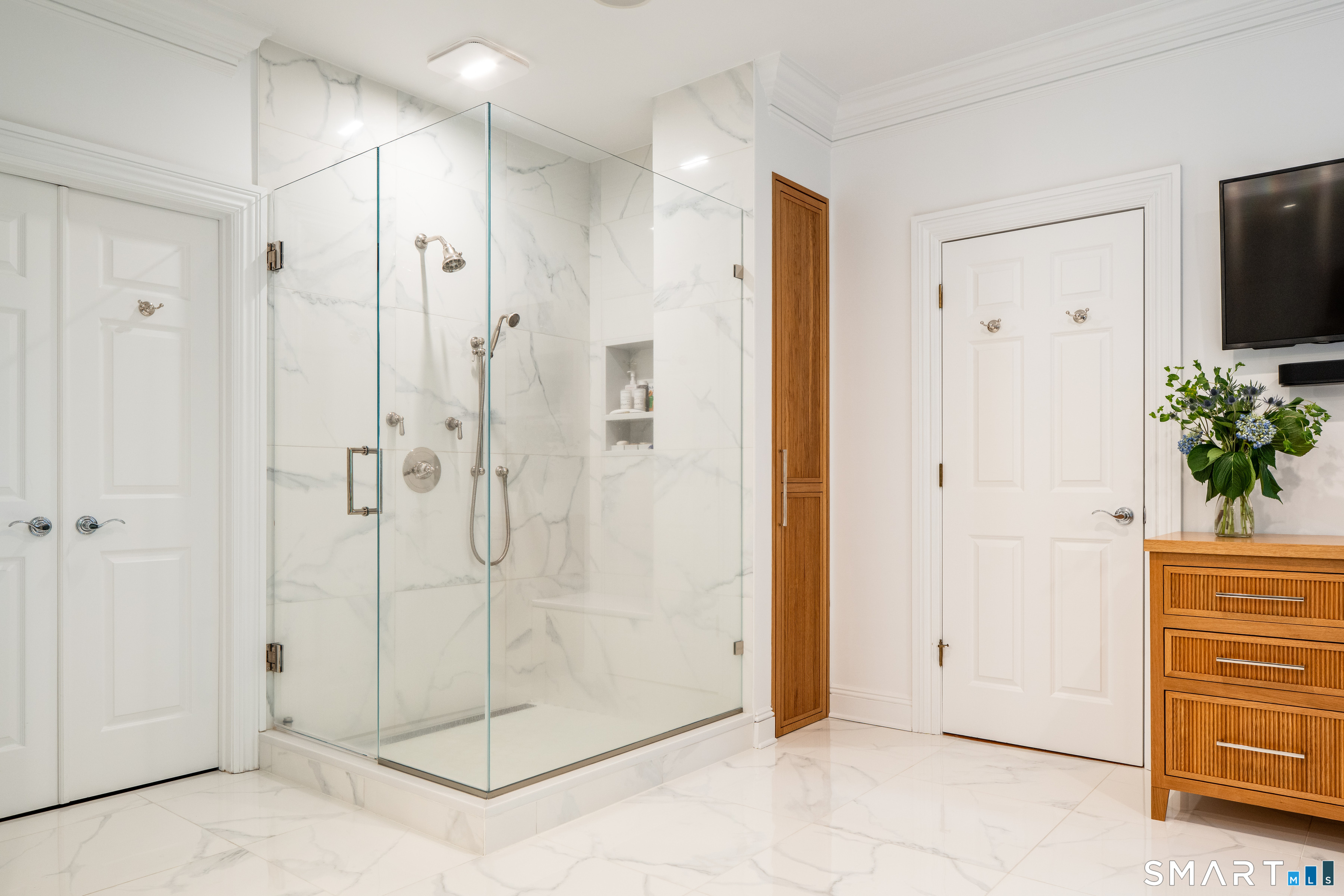 760 Smith Ridge Road New Canaan, CT 06840 - Photo 22 of 40 a bathroom with a shower and a sink