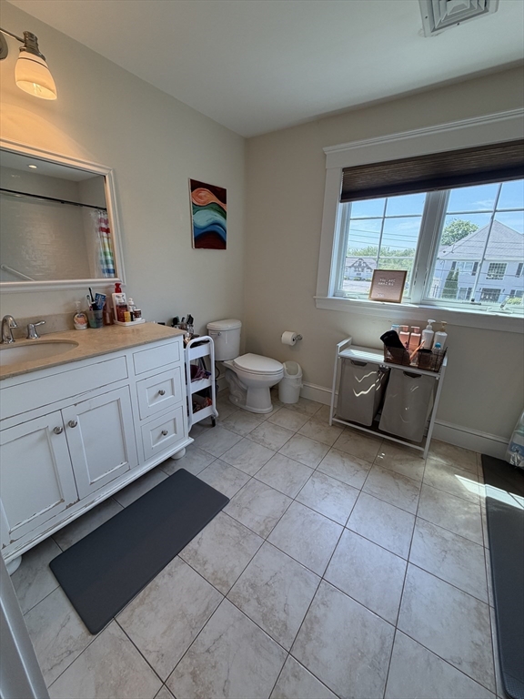 17 Cardinal Street, Unit 17 Winchester, MA 01890 - Photo 25 of 42 a room with furniture and window