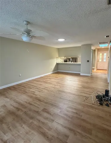 a view of a livingroom with wooden floor