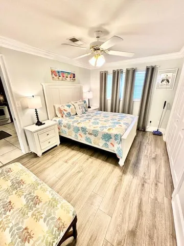 a bedroom with a bed and a dresser