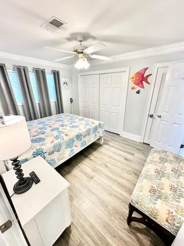 a balcony with wooden floor stairs and wooden floor