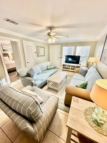 a living room with furniture and a flat screen tv