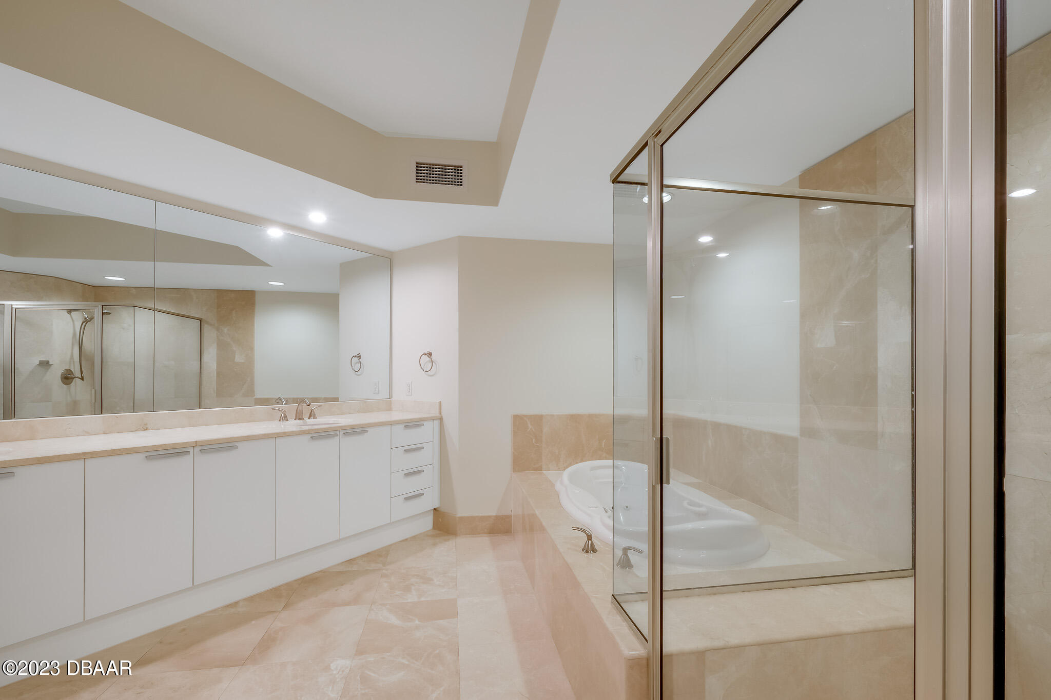 241 Riverside Drive, Unit 1710 Holly Hill, FL 32117 - Photo 22 of 46 a bathroom with a granite countertop sink mirror and bathtub