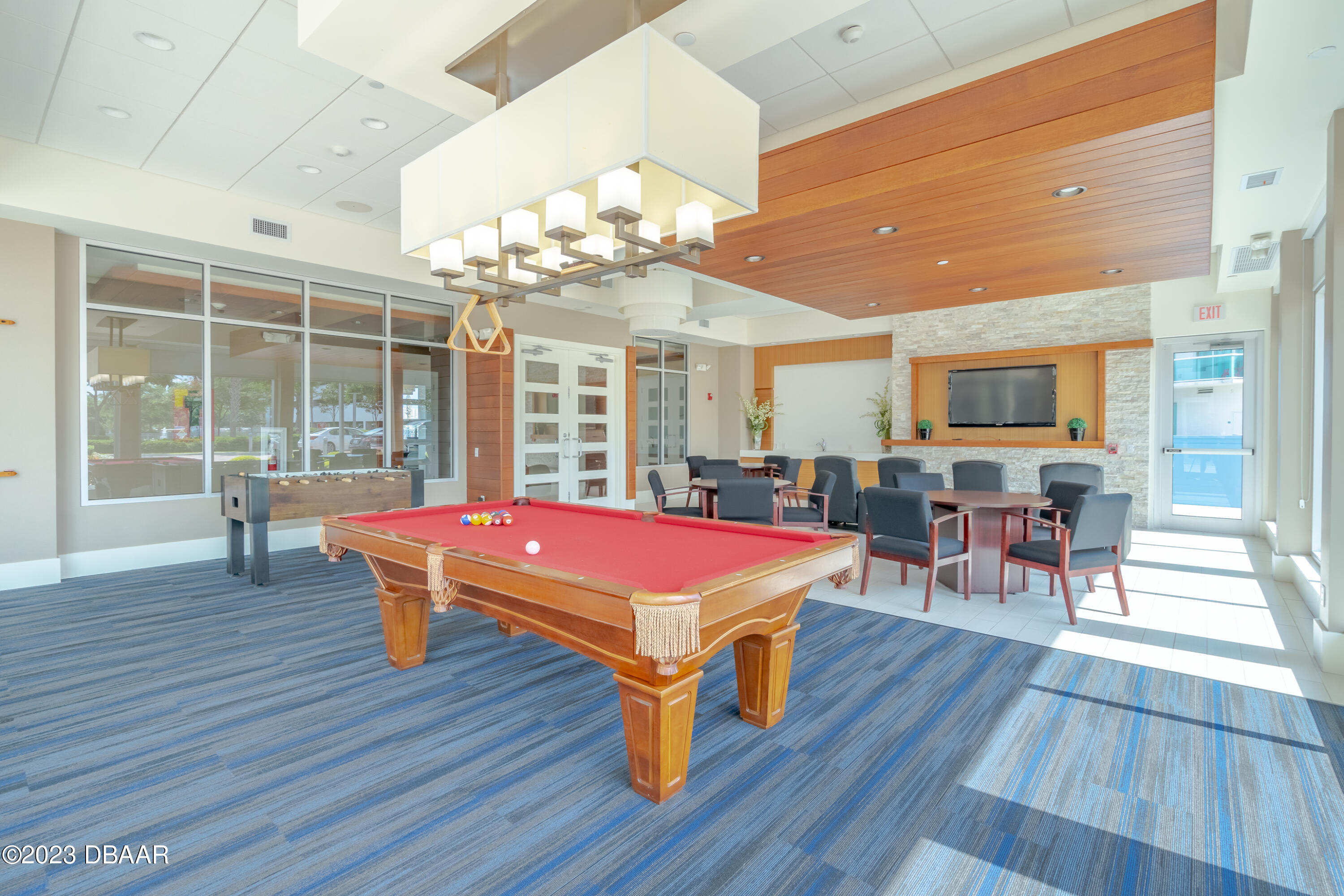 241 Riverside Drive, Unit 1710 Holly Hill, FL 32117 - Photo 41 of 46 a room with pool table and windows