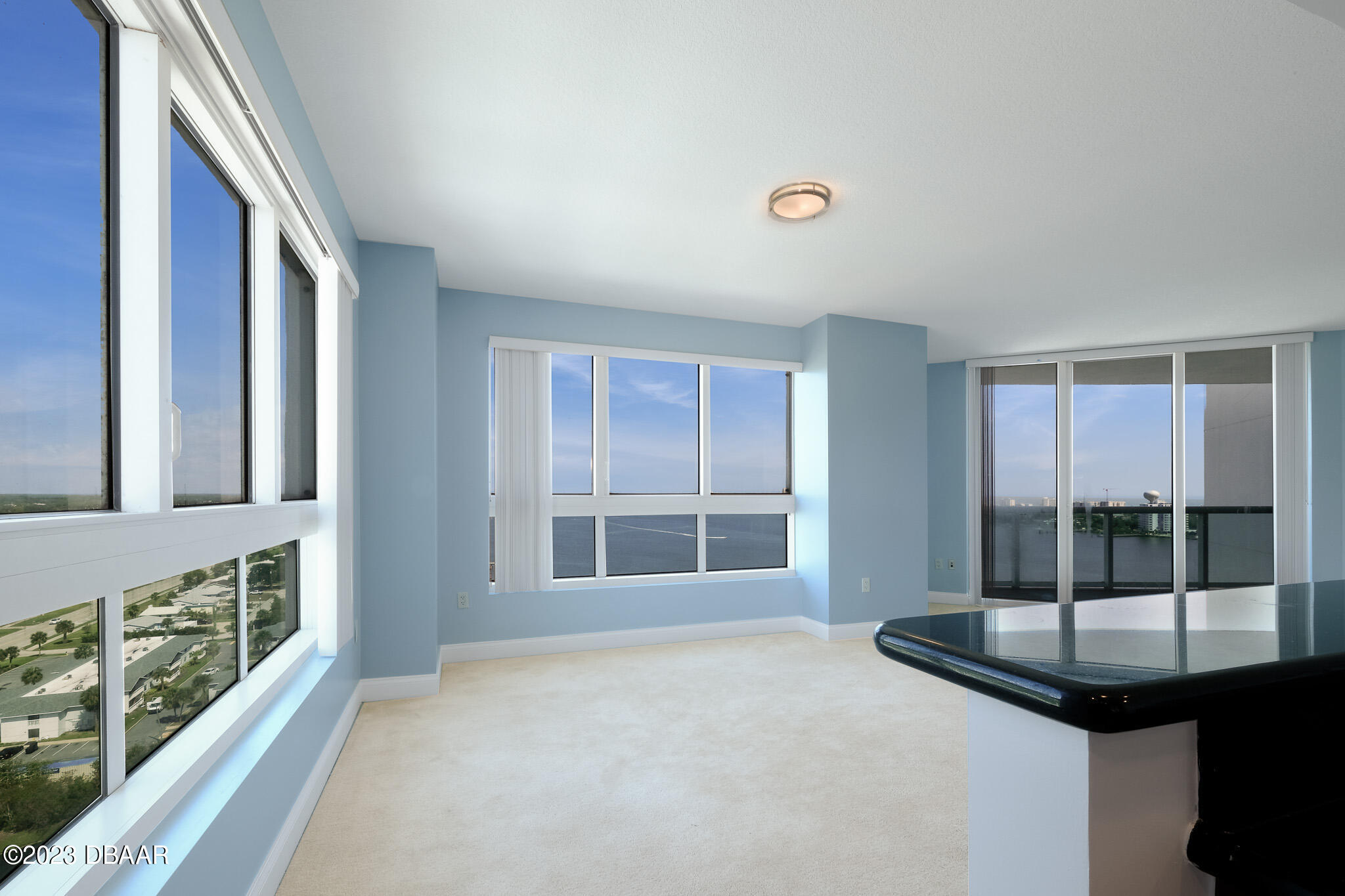 241 Riverside Drive, Unit 1710 Holly Hill, FL 32117 - Photo 10 of 46 a view of an empty room with windows