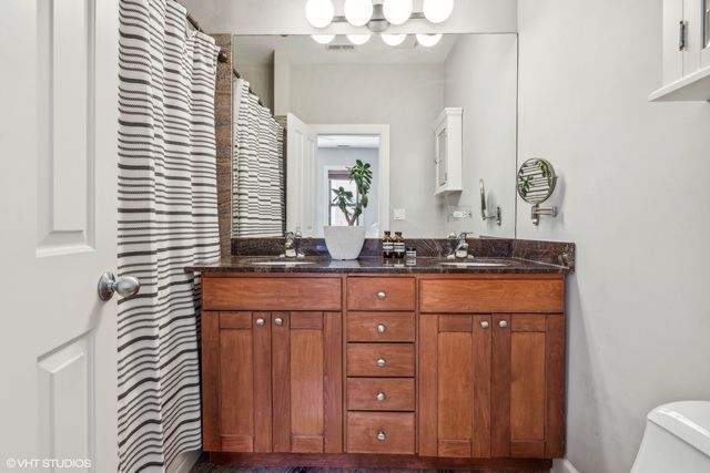 a bathroom with a sink a vanity and a mirror