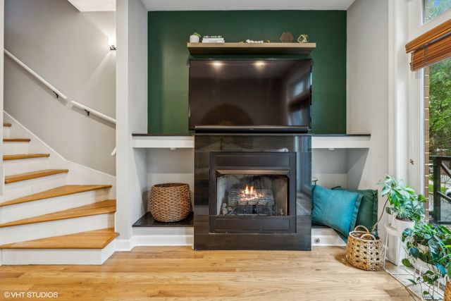 a living room with a fireplace and a fireplace