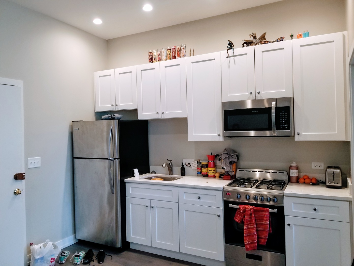4764 North Virginia Avenue, Unit 112 Chicago, IL 60625 - Photo 4 of 12 a kitchen with stainless steel appliances a refrigerator sink and cabinets