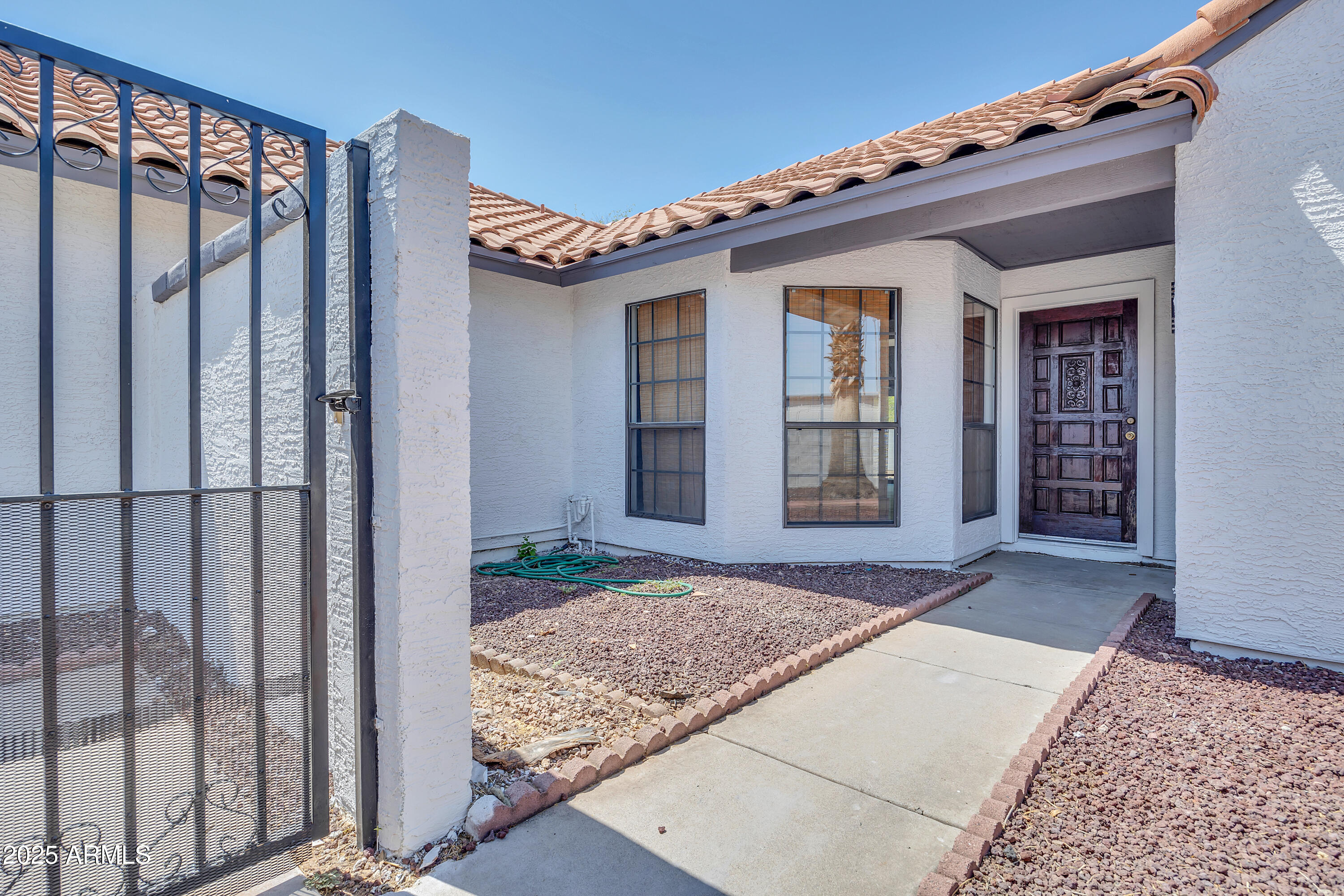 5302 West Cheryl Drive Glendale, AZ 85302 - Photo 3 of 39 front view of a house with a porch