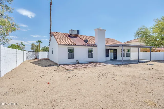 a front of a house with a wooden deck