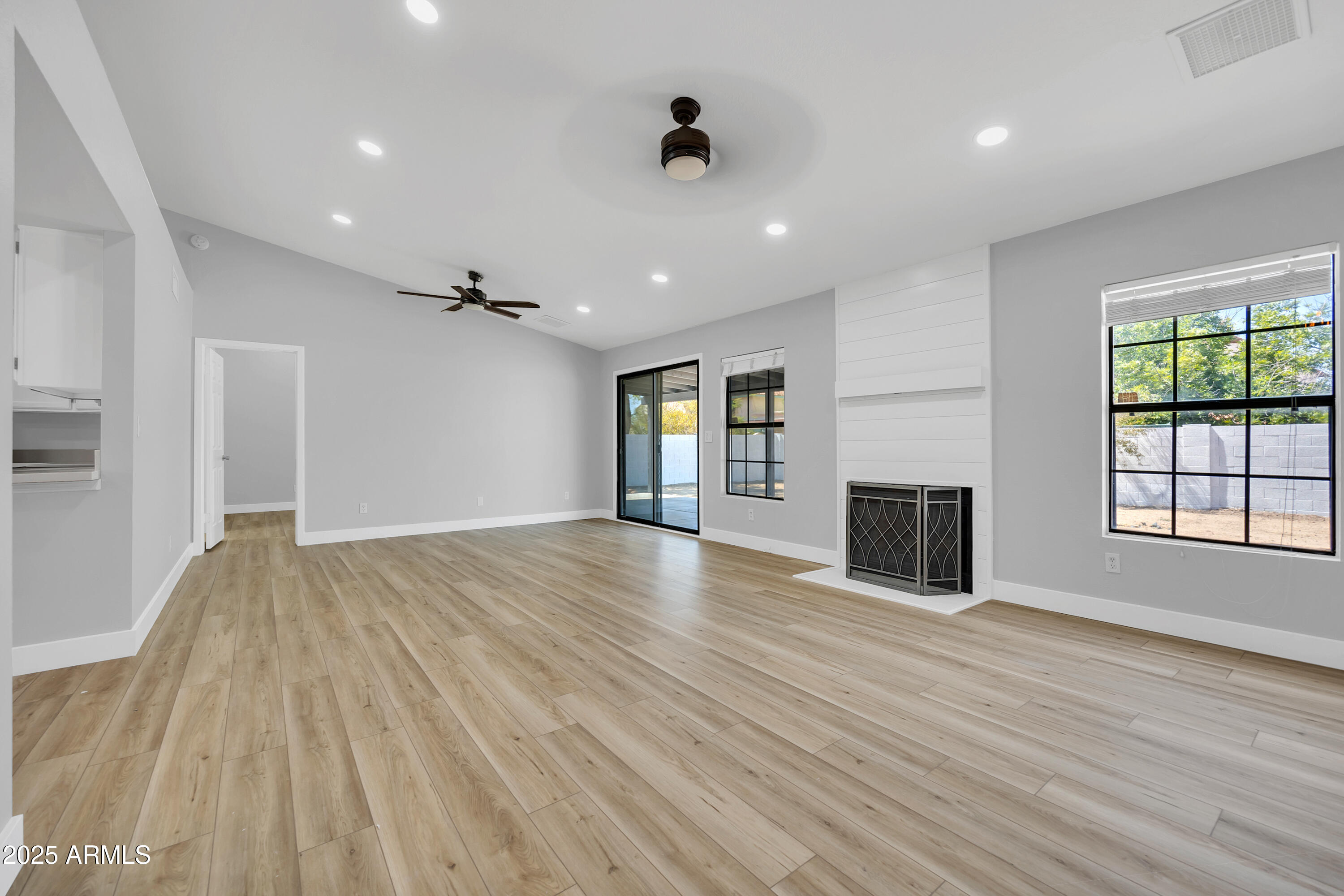 5302 West Cheryl Drive Glendale, AZ 85302 - Photo 10 of 39 wooden floor in an empty room with a window