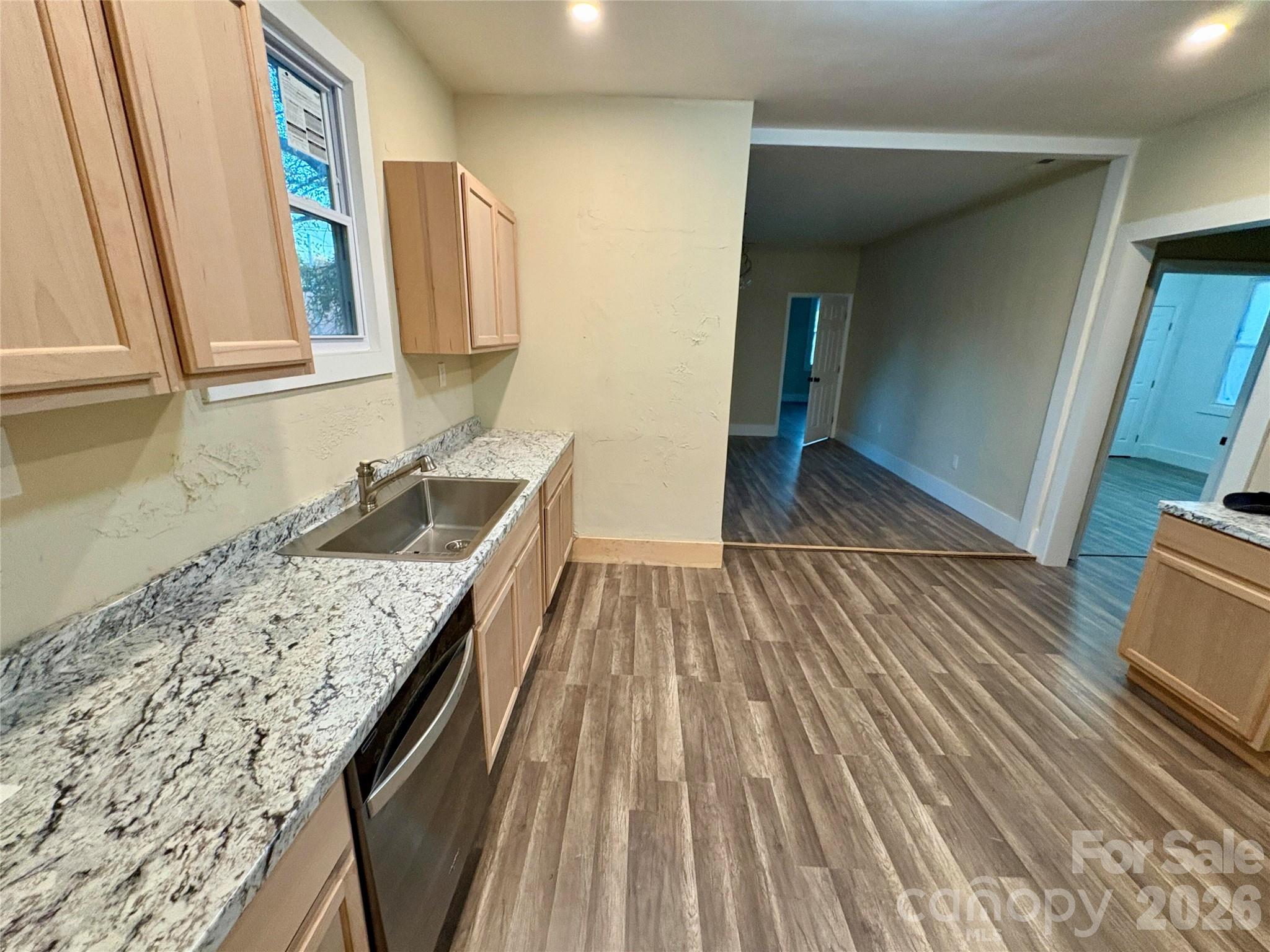 427 East Orr Street Anderson, SC 29621 - Photo 11 of 24 a kitchen with a sink and wooden floor