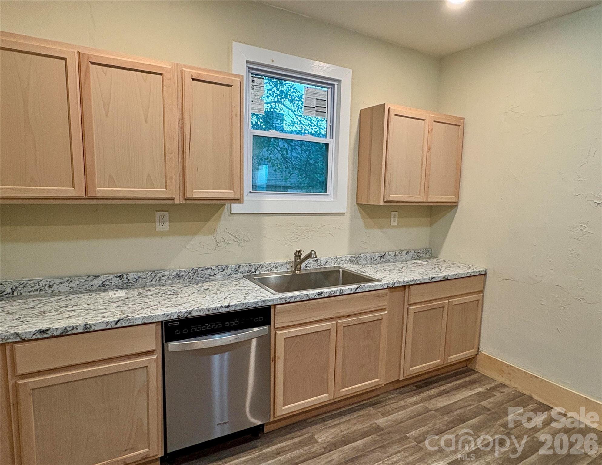 427 East Orr Street Anderson, SC 29621 - Photo 13 of 24 a kitchen with stainless steel appliances granite countertop a sink and dishwasher with wooden floor
