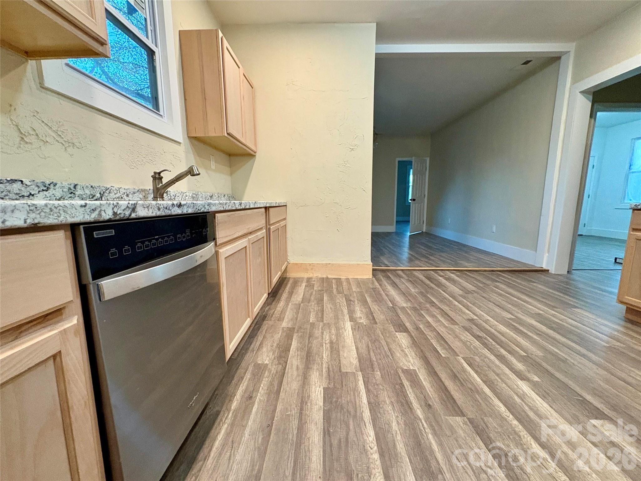 427 East Orr Street Anderson, SC 29621 - Photo 14 of 24 a kitchen with granite countertop a sink and cabinets