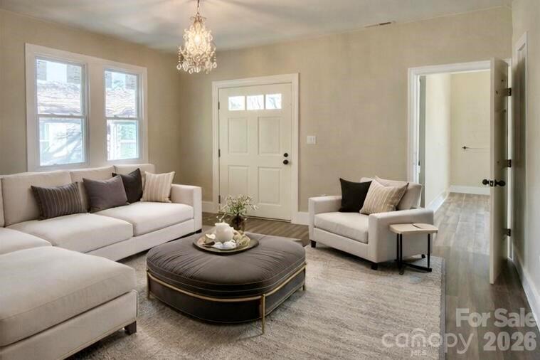 427 East Orr Street Anderson, SC 29621 - Photo 16 of 24 a living room with furniture and a chandelier
