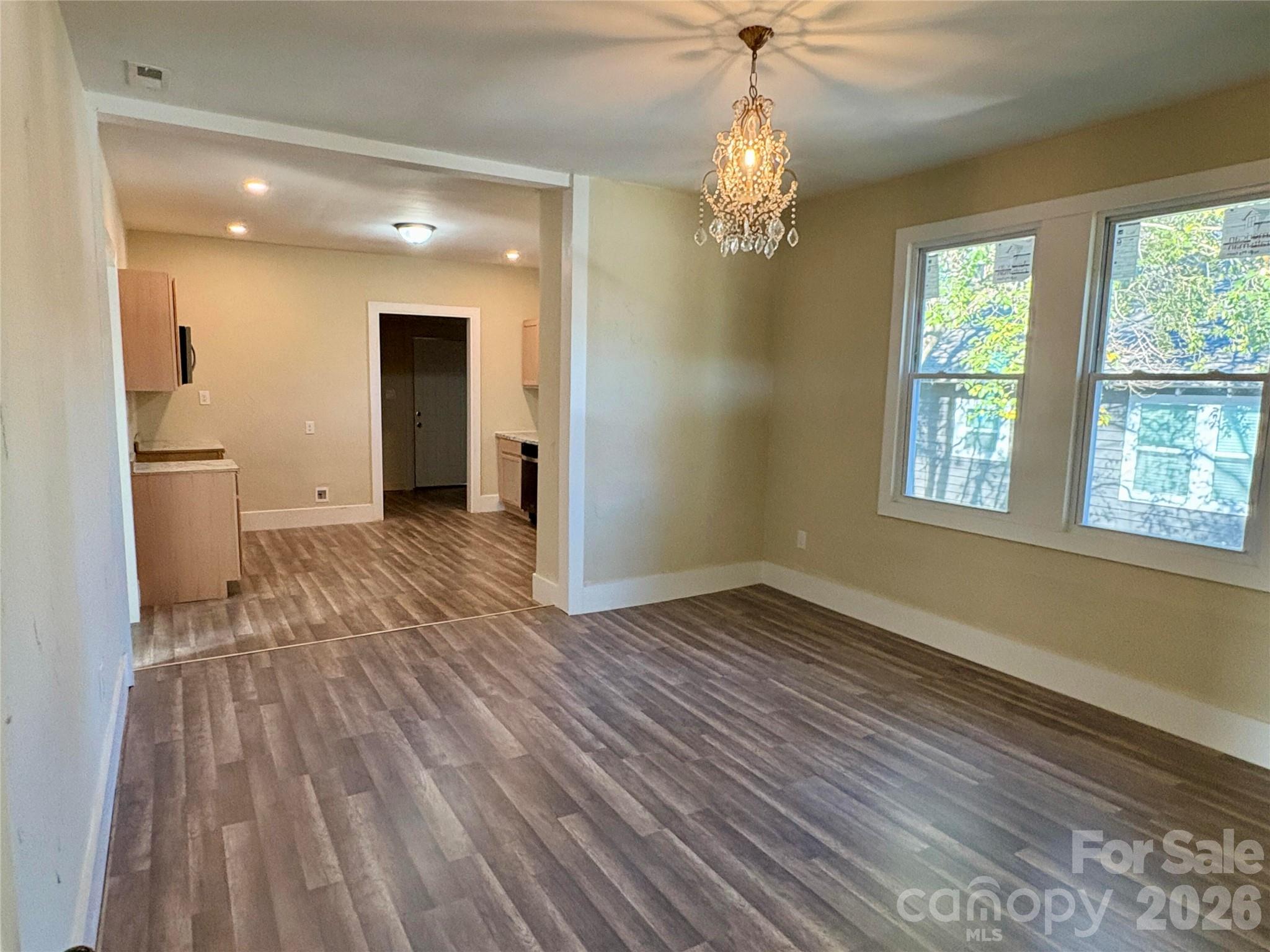 427 East Orr Street Anderson, SC 29621 - Photo 19 of 24 wooden floor in an empty room with a window
