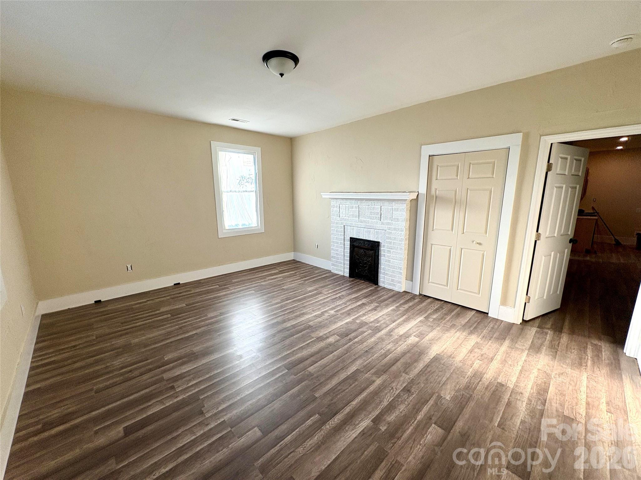 427 East Orr Street Anderson, SC 29621 - Photo 20 of 24 a view of empty room with wooden floor and fan