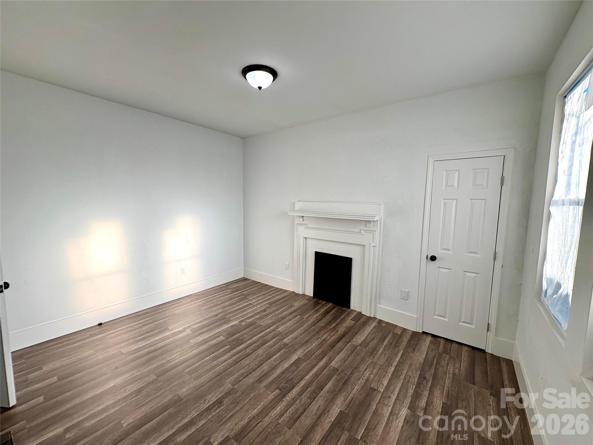 427 East Orr Street Anderson, SC 29621 - Photo 21 of 24 a view of empty room with wooden floor and fan