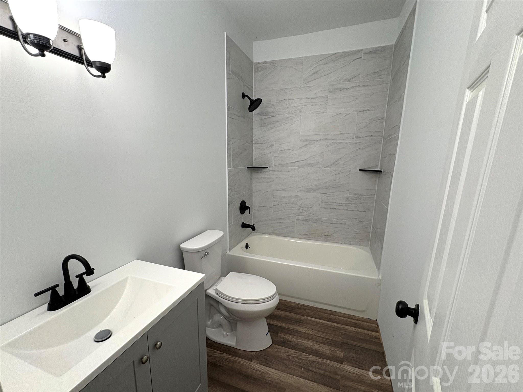 427 East Orr Street Anderson, SC 29621 - Photo 5 of 24 a bathroom with a sink toilet and shower