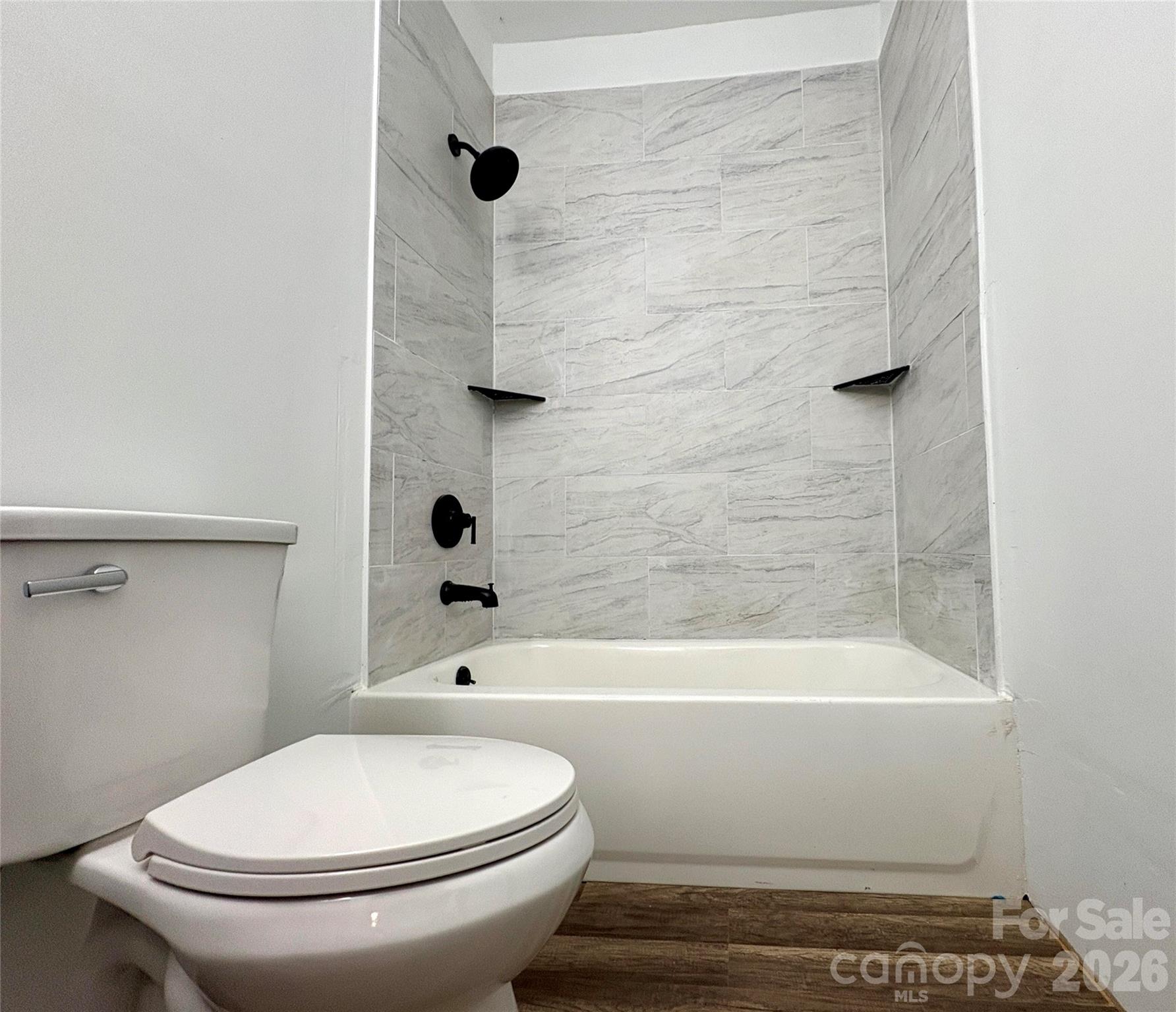 427 East Orr Street Anderson, SC 29621 - Photo 6 of 24 a bathroom with a toilet and a shower