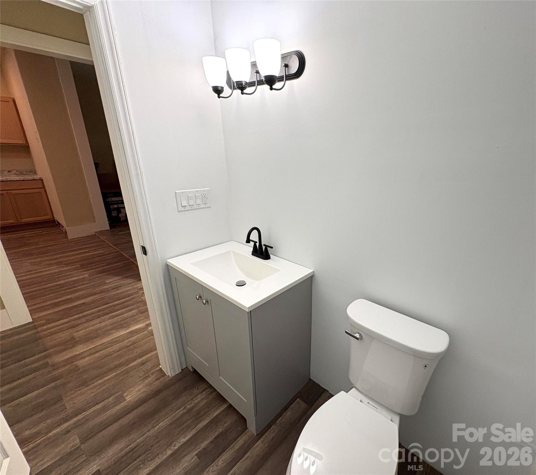 427 East Orr Street Anderson, SC 29621 - Photo 9 of 24 a white toilet sitting next to a bathroom sink