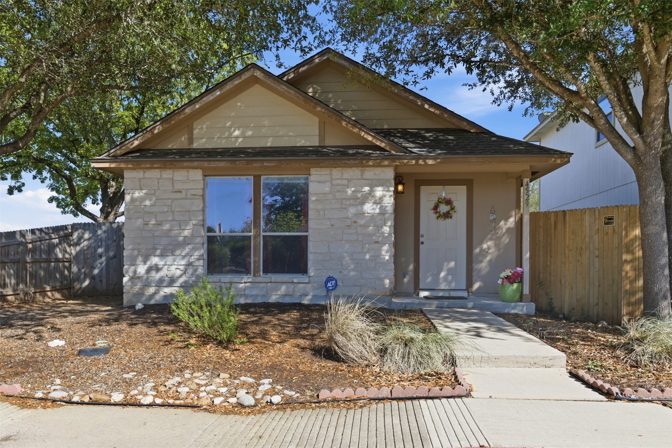 a front view of a house with garden
