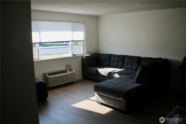 a living room with furniture and a table