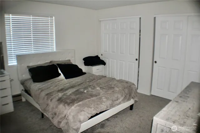 a view of a backyard with table and chairs