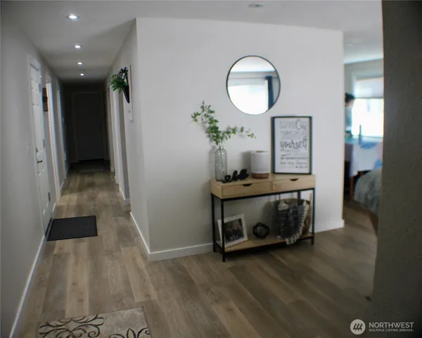 a view of room with furniture and wooden floor