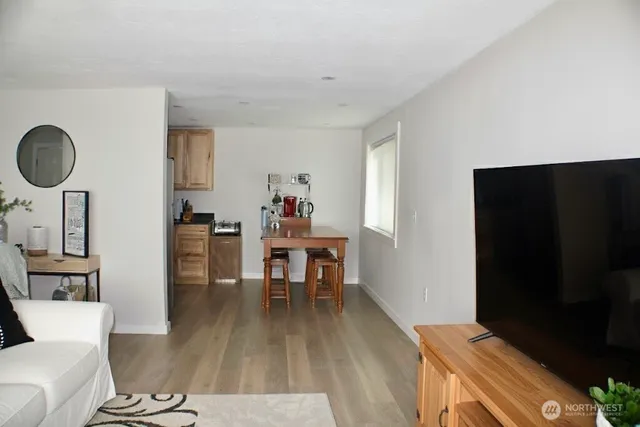 a kitchen with stainless steel appliances granite countertop a sink dishwasher stove and cabinets