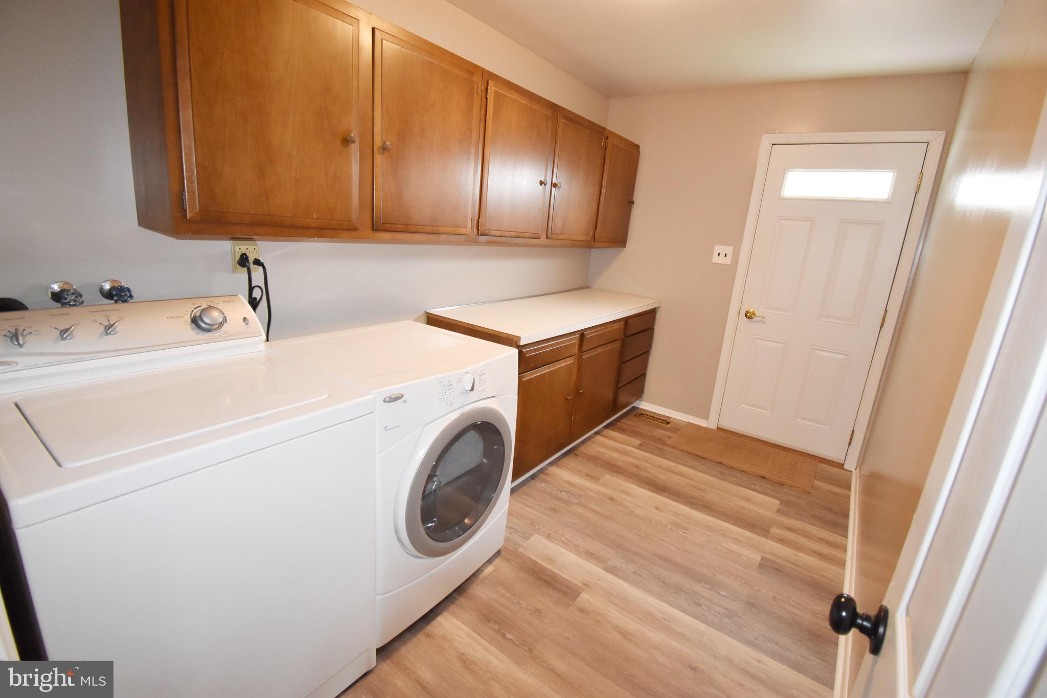 752 Wyngate Road Somerdale, NJ 08083 - Photo 10 of 20 Laundry room with laminate floor with side door
