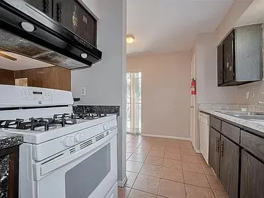 a kitchen with a stove and a microwave