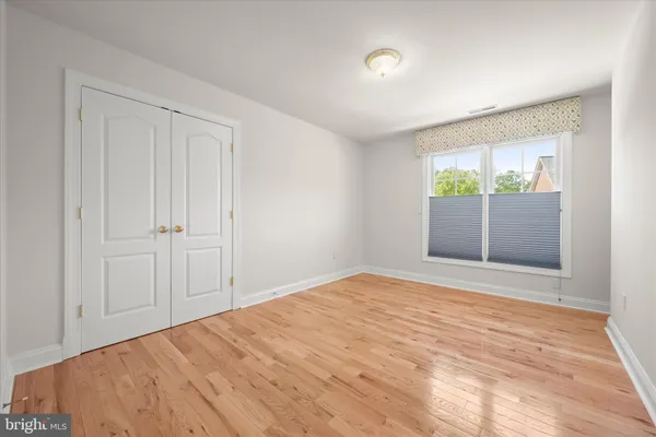 a bathroom with a shower curtain and a window