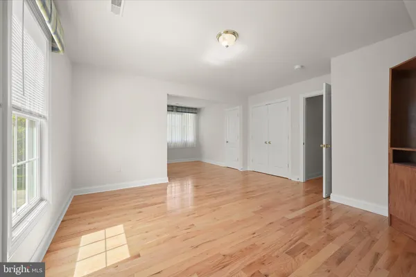 a bedroom with a bed and a table