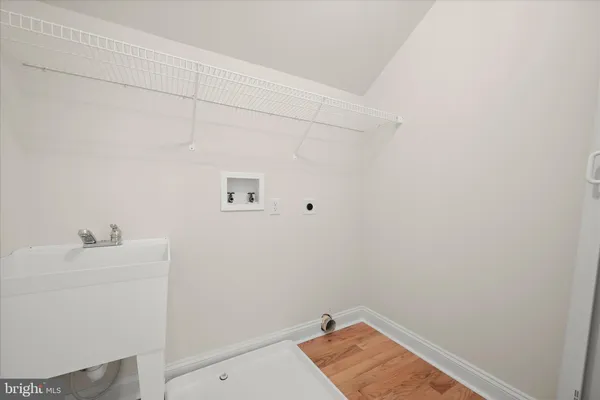a view of an empty room and a window