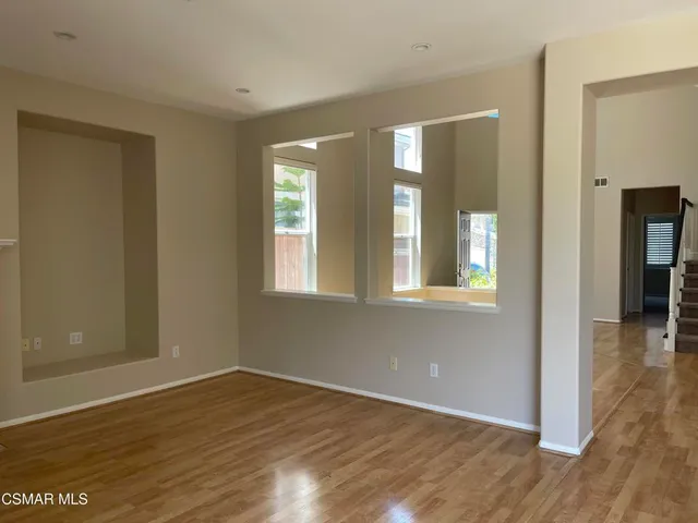 a view of livingroom with hardwood floor and hallway