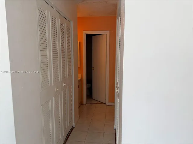 a view of a bathroom from a hallway