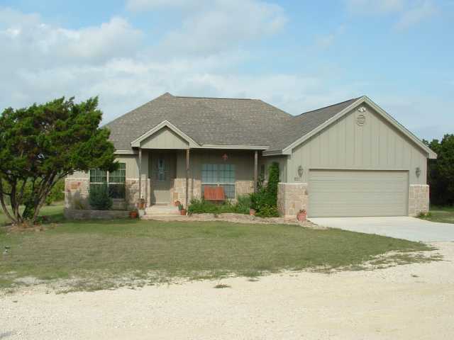 851 Old Red Ranch Road Dripping Springs, TX 78620 - Photo 1 of 1 a front view of a house with a yard and garage