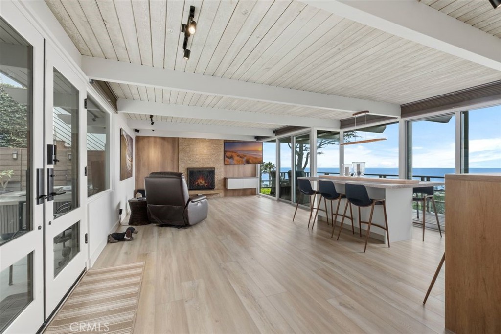 945 Coast View Drive Laguna Beach, CA 92651 - Photo 13 of 40 a living room with furniture and a wooden floor